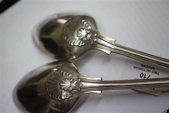 A matched pair of Victorian silver double struck scroll rosette pattern basting spoons, 12.5 oz.